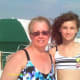 Grandmother and granddaughter enjoying beach time together.