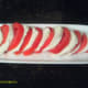 Alternate the cheese between the tomato slices