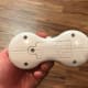 Remove the panel on the back of the remote control to swap out the batteries.