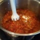 Step 18: But first I use my immersion blender to blend it up a bit as we like our sauce relatively smooth.