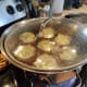 Step Nine: When it starts to boil rapidly, tilt the lid and turn the heat down a couple notches. Set the timer.
