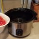 Chop up all of your tomatoes and add them to the crockpot.