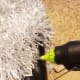 Hot glue your silver garland around your old container.