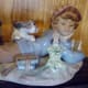 Another view of the Lladro porcelain with boy, dog and bird