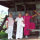 My aunt, mother, me, and my uncle are standing in front of an old stagecoach on the grounds of the Cody Homestead.
