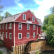 The mill still works. Purchase ground grains inside along with other wares.