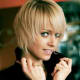 Short blonde razor cut.