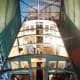 Overview of ex-LMS brakevan 732195 under restoration showing interior divisions lit up prior to re-roofing (timber forme baulks and longitudinal strakes with treated canvas covering)