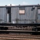 Early 'matchboard' North Eastern ballast brake van at Alexandra Dock Hull awaiting scrapping or preservation - one stands on the sidings at Goathland behind 'Up' platform