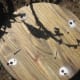 Once the stakes are in the ground lay the board on top readying for the screws.