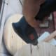 Be careful to maintain the power drill as straight as possible perpendicular to the board's surface.