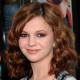 Stylish medium-length curly hair for a young lady