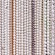 Once polished and drilled, pearls are often strung to be sold in strands.