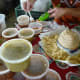 Salsas being sampled at the Farmer’s Market at Imperial Sugar Land