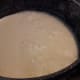 Boiling the milk, till it becomes creamy, and reduces into half