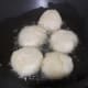 Frying the vadas in the pan