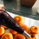 Fill a piping bag or resealable plastic bag (with the corner snipped off) with jam.