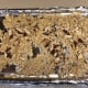 Place broken ramen and sliced almonds on a baking sheet