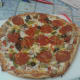 out of the oven - it warped I added my own extra cheddar on top