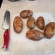 Wash and slice 6 potatoes into 1/8ths.