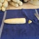 Now it's time to cut the corn from the cob. Cut the end off of one to have a flat surface to set it on.