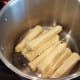 Place corn cobs in the bottom of your pot.