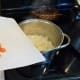 Add carrots to the pot. Cook down until the onion is transparent and the carrots are soft, stirring frequently.