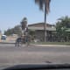 A man double checks his bicycle near Chester Avenue
