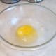 Add an egg to your mixing bowl.