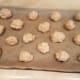 Roll biscuits sized balls together and lay them out evenly on your cookie sheet. We smashed them down a bit.