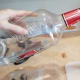 Using a funnel, cover your vanilla beans in vodka.