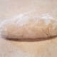 Remove your dough from the refrigerator and dump it out onto a clean surface. Squeeze together and knead until it forms into a solid dough. You might need a bit more cold water.