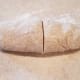 Divide it in half and re-wrap one side and put it back into the refrigerator while you're rolling out the first one.