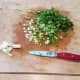 Crumble your bacon and sprinkle your chives over the top of your potatoes in the crockpot, and then cover the pot and cook on high 4-5 hours.
