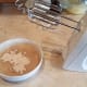 So I used a hand mixer and beat in one tablespoon of flour at a time as it visibly thickened. I ended up adding 4 tablespoons while checking flavor and consistency the whole time.