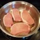 Add your pork chops and brown on both sides over medium heat. This may take 5-10 minutes on both sides or so.