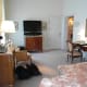 TV and arch to entrance.