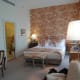 Bed and door into bathroom.