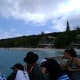 The line of people waiting on the jetty for a tender boat to return them to the ship.