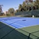 There are two tennis courts on the grounds, one of them doubles as a basketball court.