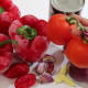 Clockwise from top right: Tomato purée, onion, fresh plum tomato, ginger, garlic, habanero pepper, and bell pepper