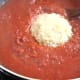 Once the purée has formed a thick consistency, add the rice and salt. Cook for about 5 minutes, allowing the rice to absorb the purée.