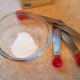 Mix your baking soda and hot water in a small bowl until the baking soda has dissolved.