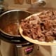 Then add the meat back into the sauce and stir around.