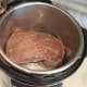 Then add in your pot roast to brown it on both sides. You'll want a thawed roast, rather than frozen.