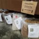 Bags of raw fleece fit nicely under the table at market.
