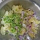 Mash the potatoes and add chopped onion and ginger chilli paste.