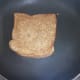 Spread some butter on both sides and start roasting till the sandwich is golden and crisp.