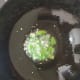 Add 2 teaspoons oil or ghee (clarified butter). Heat it, add mustard seeds and green chillies.