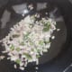 Add chopped onions and stir for 1 minute.